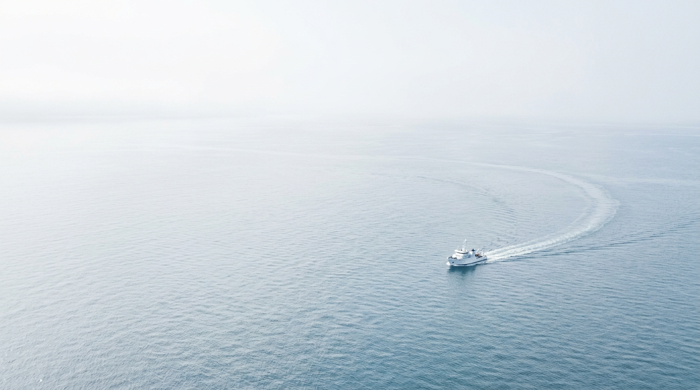 A vessel crossing a calm stretch of open ocean